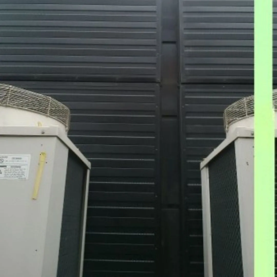 Sound-Absorbing Wall Panels Installed in Gym Near External AC Unit