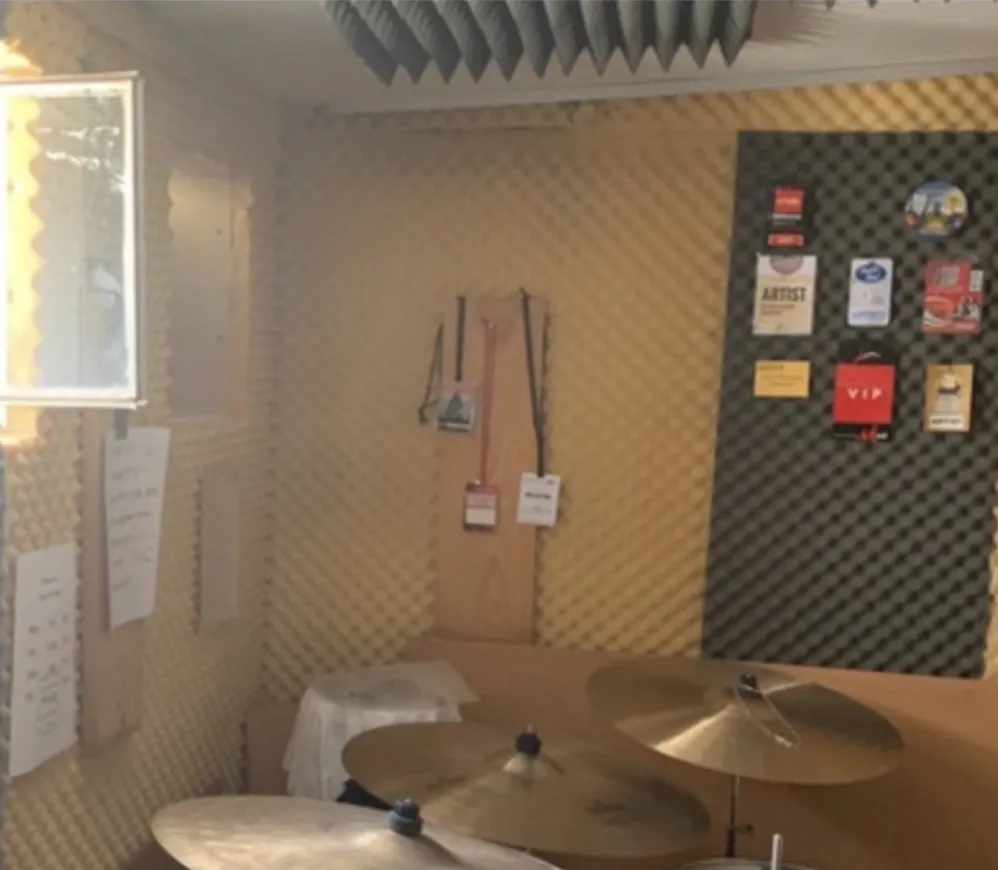 Custom acoustic and vibration isolation for a drum studio
